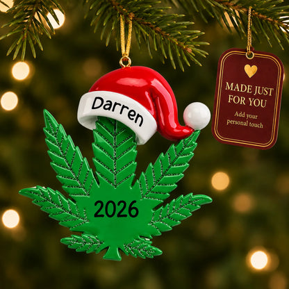 Cannabis leaf santa hat christmas ornament hanging on a lit Christmas tree with a Made Just For You gift tag