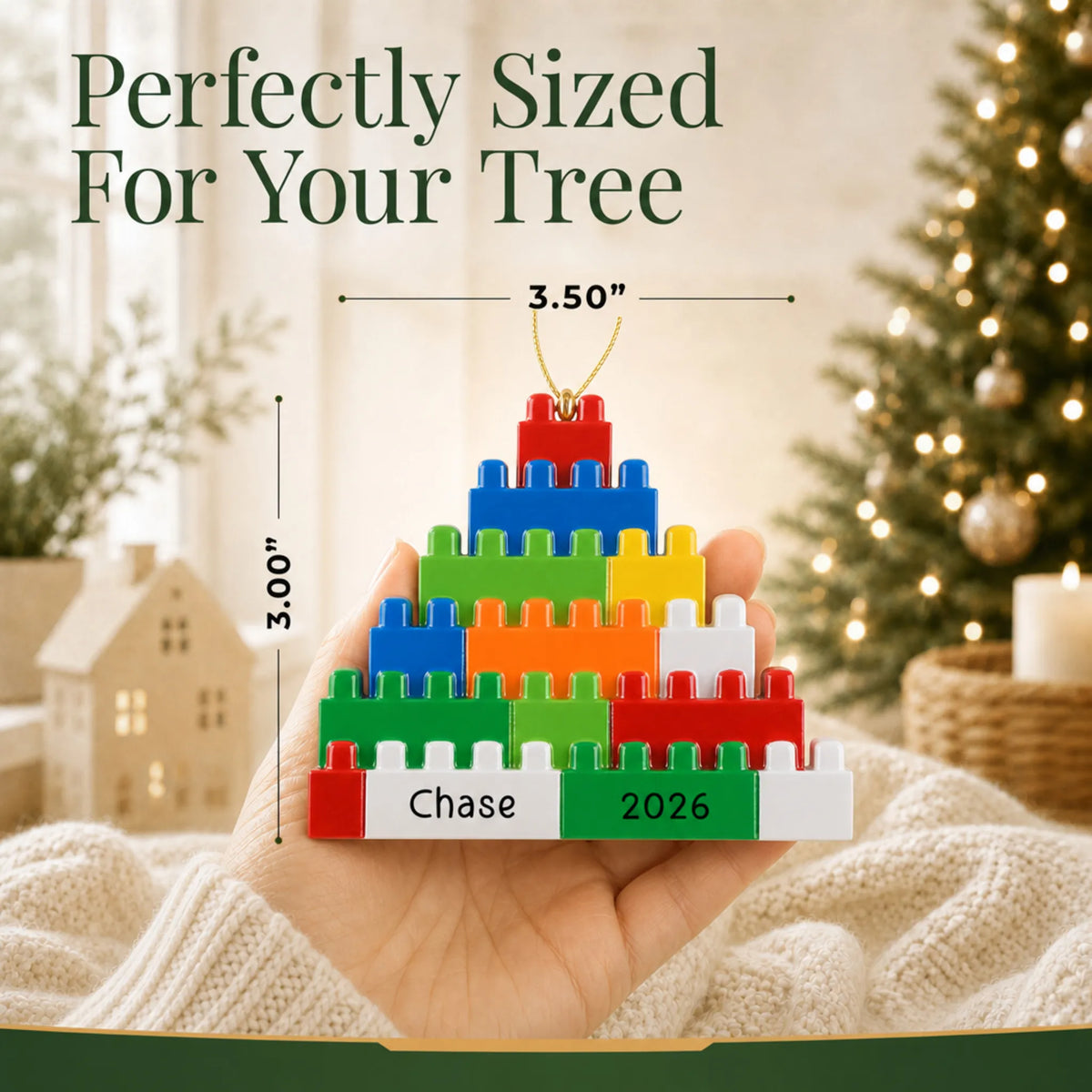 Size guide: the personalized building blocks christmas ornament is 3.50 in wide by 3.00 in tall, shown in hand