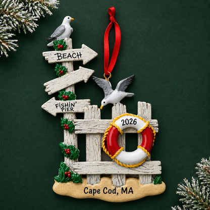 Personalized beach gate christmas ornament on a dark green pine background