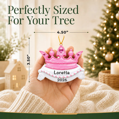 Size guide: the personalized pink princess crown christmas ornament is 4.50 in wide by 3.50 in tall, shown in hand