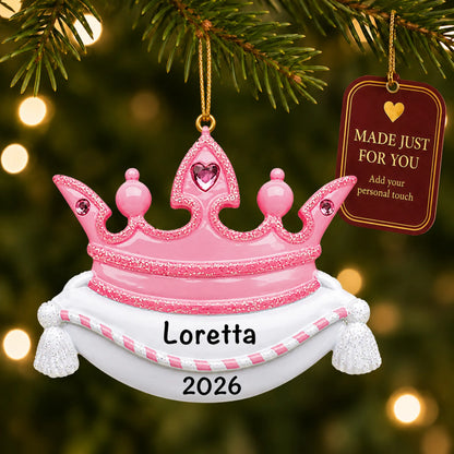 Pink princess crown christmas ornament hanging on a lit Christmas tree with a Made Just For You gift tag