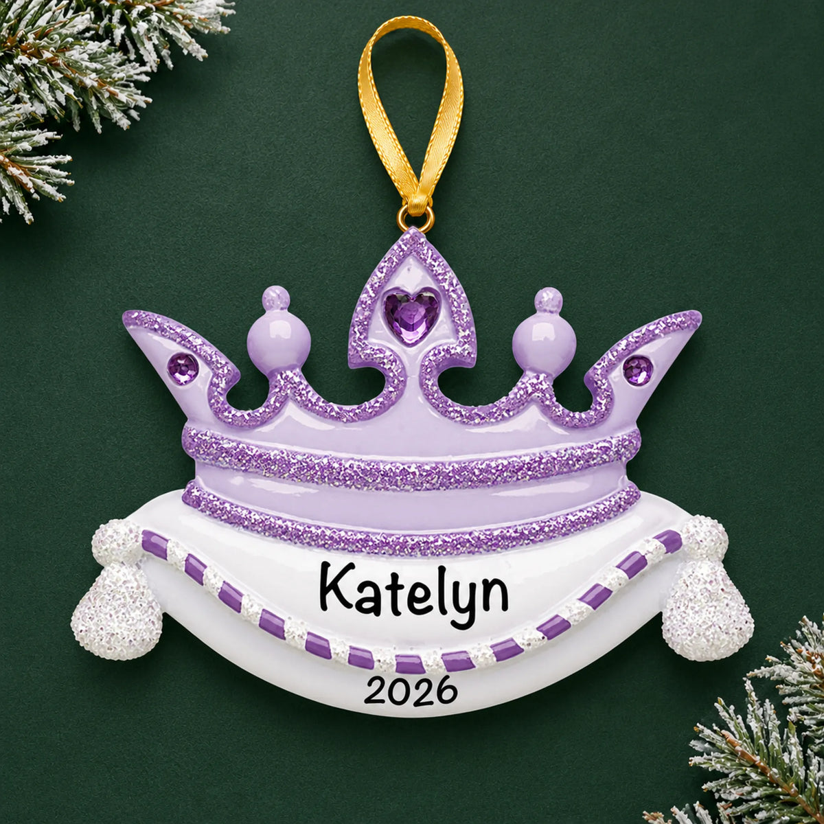 Personalized purple princess crown christmas ornament on a dark green pine background