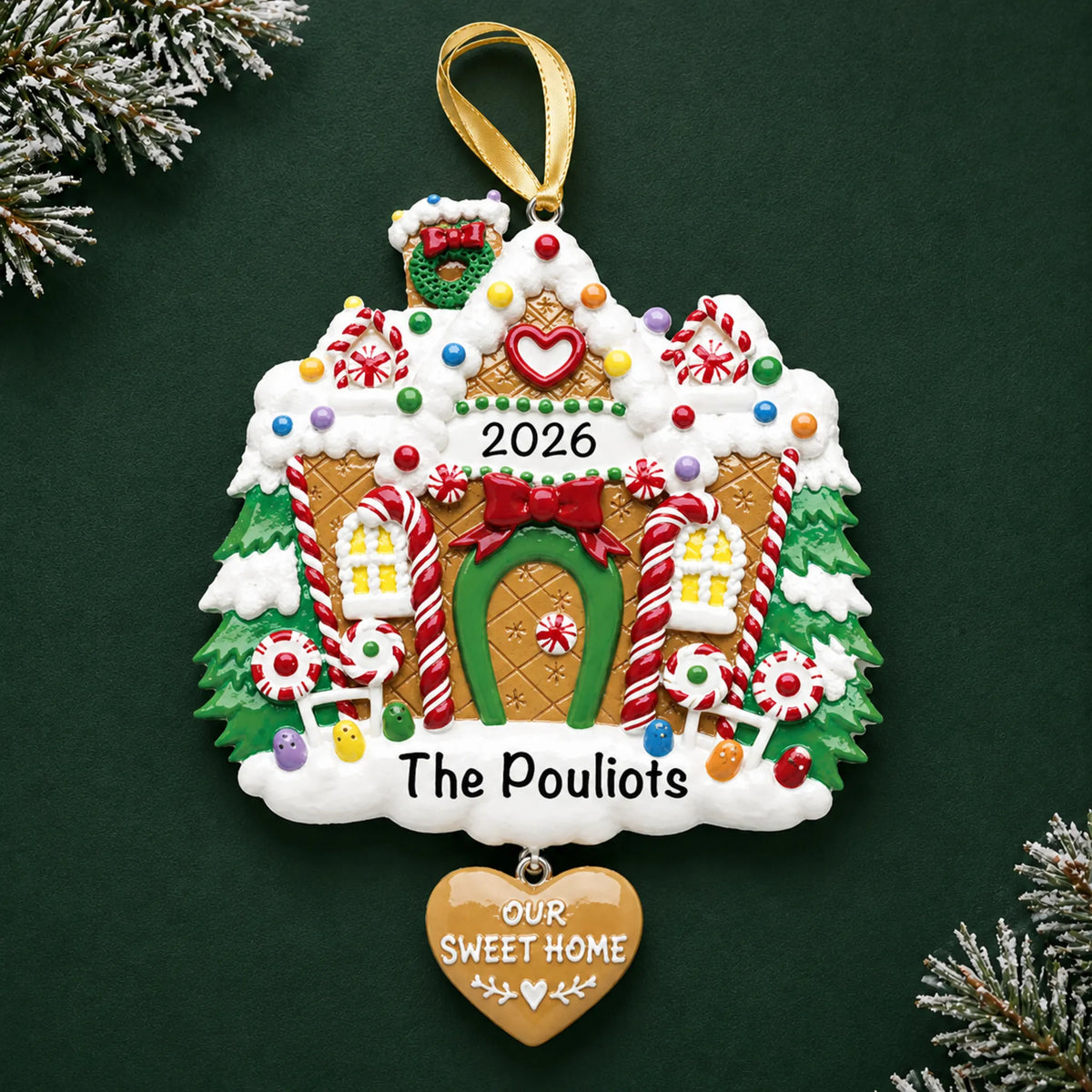 Personalized Gingerbread House christmas ornament on a dark green pine background