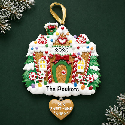Personalized Gingerbread House christmas ornament on a dark green pine background