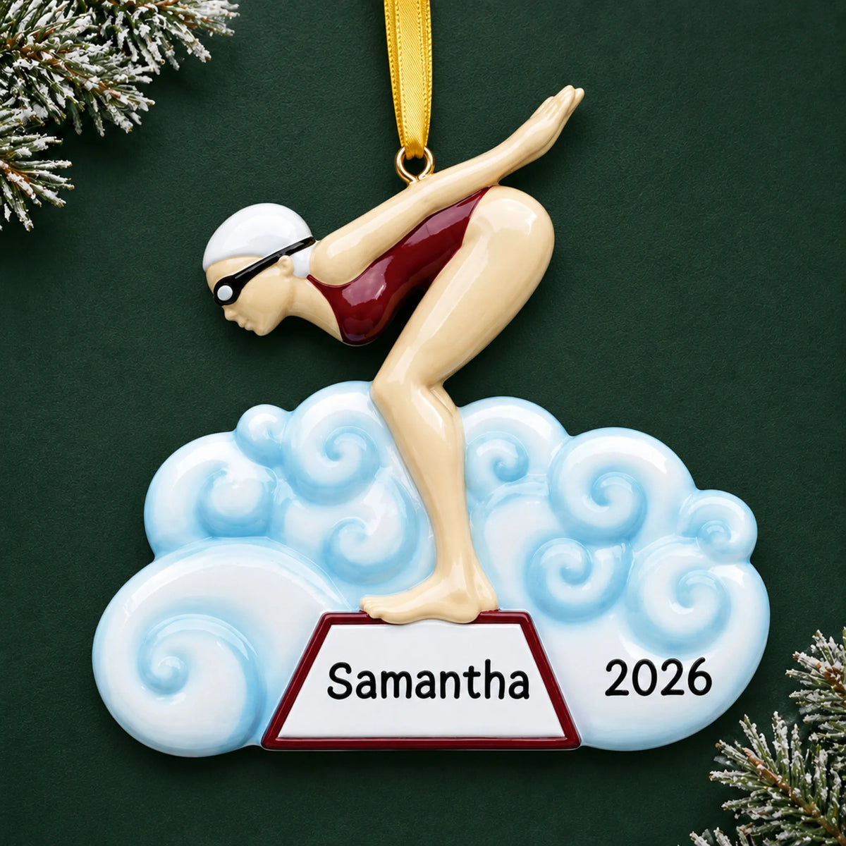 Personalized girl swimmer christmas ornament on a dark green pine background