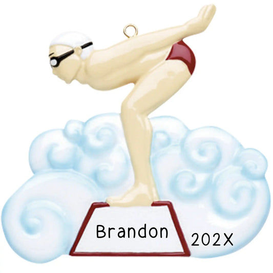 Personalized Christmas ornament featuring a male swimmer in red trunks, cap, and goggles, poised on a starting block above a blue water cloud, ready for custom engraving.