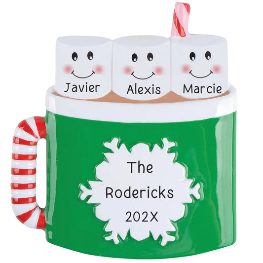 Personalized hot cocoa family of three ornament featuring smiling marshmallows in a green mug with candy cane handle, laser engraved names, and year.