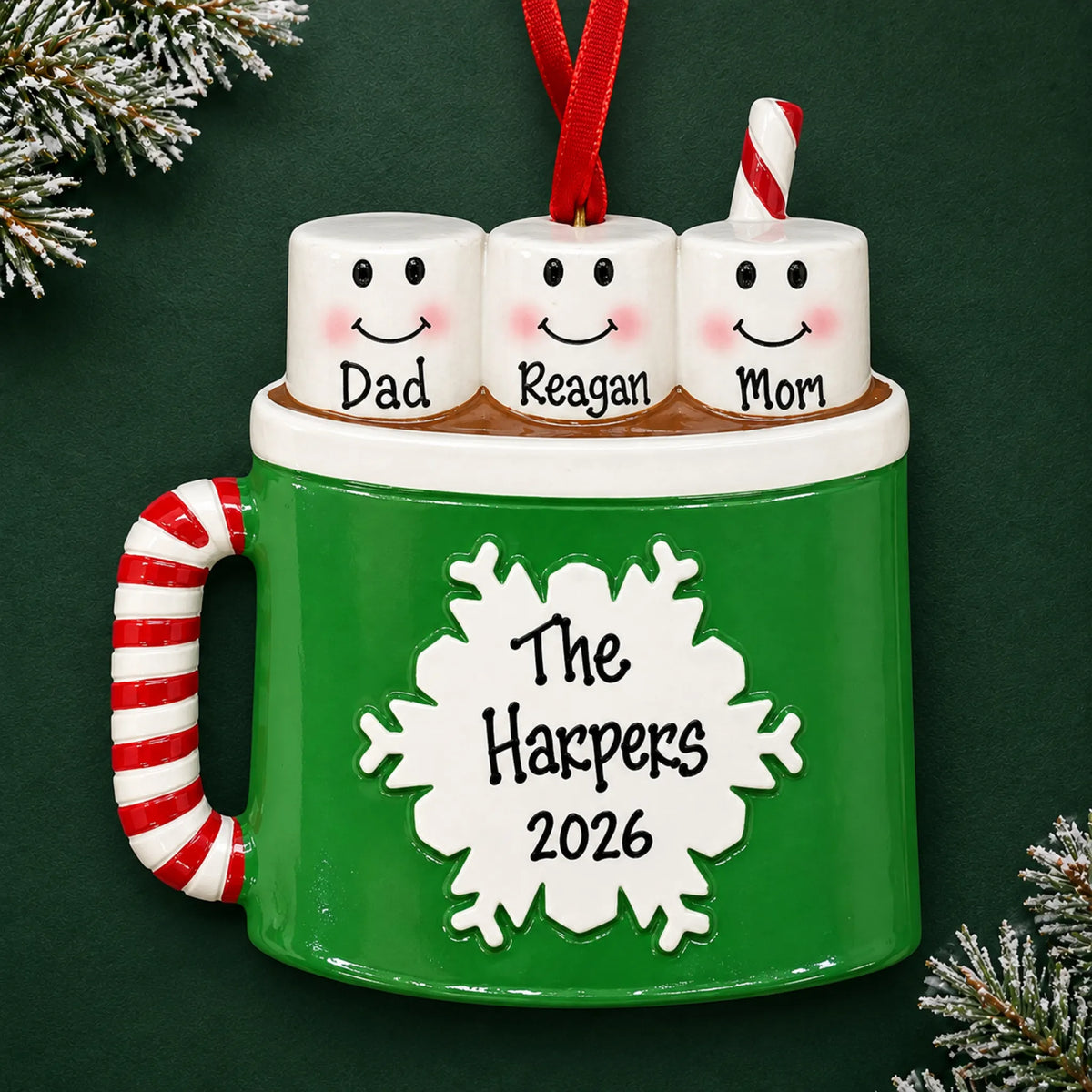 Personalized hot cocoa family of 3 christmas ornament on a dark green pine background