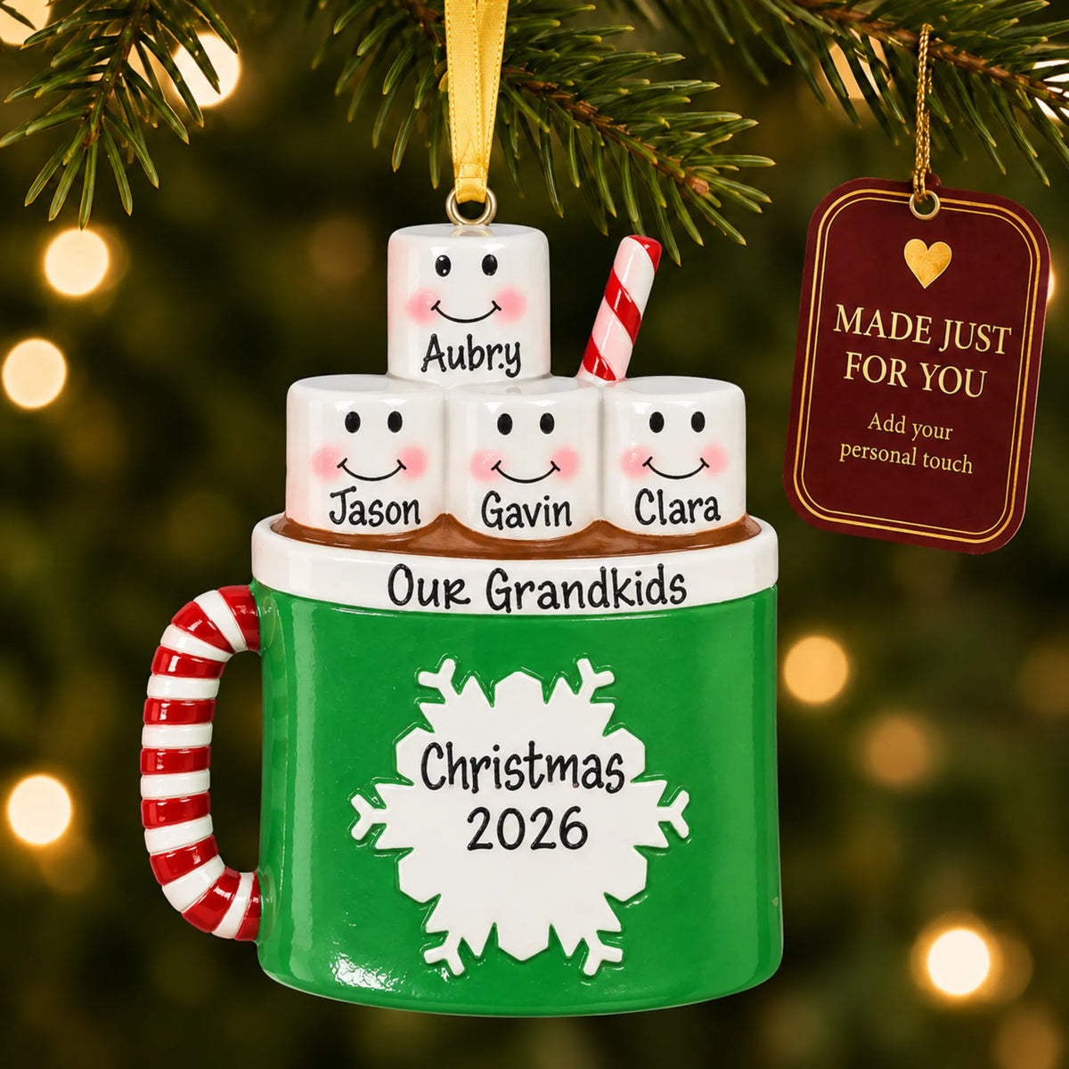 Hot cocoa family of 4 christmas ornament hanging on a lit Christmas tree with a Made Just For You gift tag
