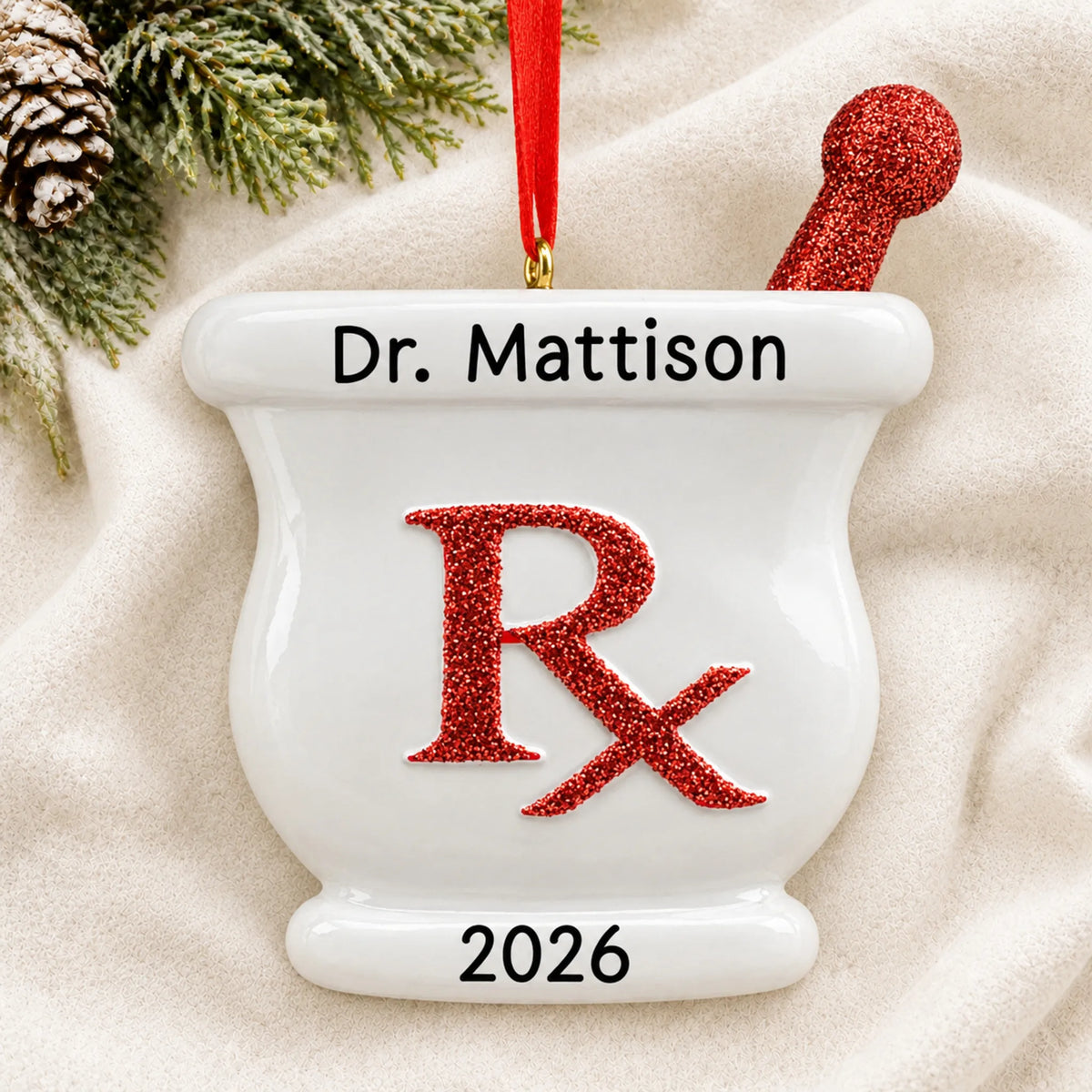 Personalized pharmacist RX christmas ornament laid on a soft white knit blanket