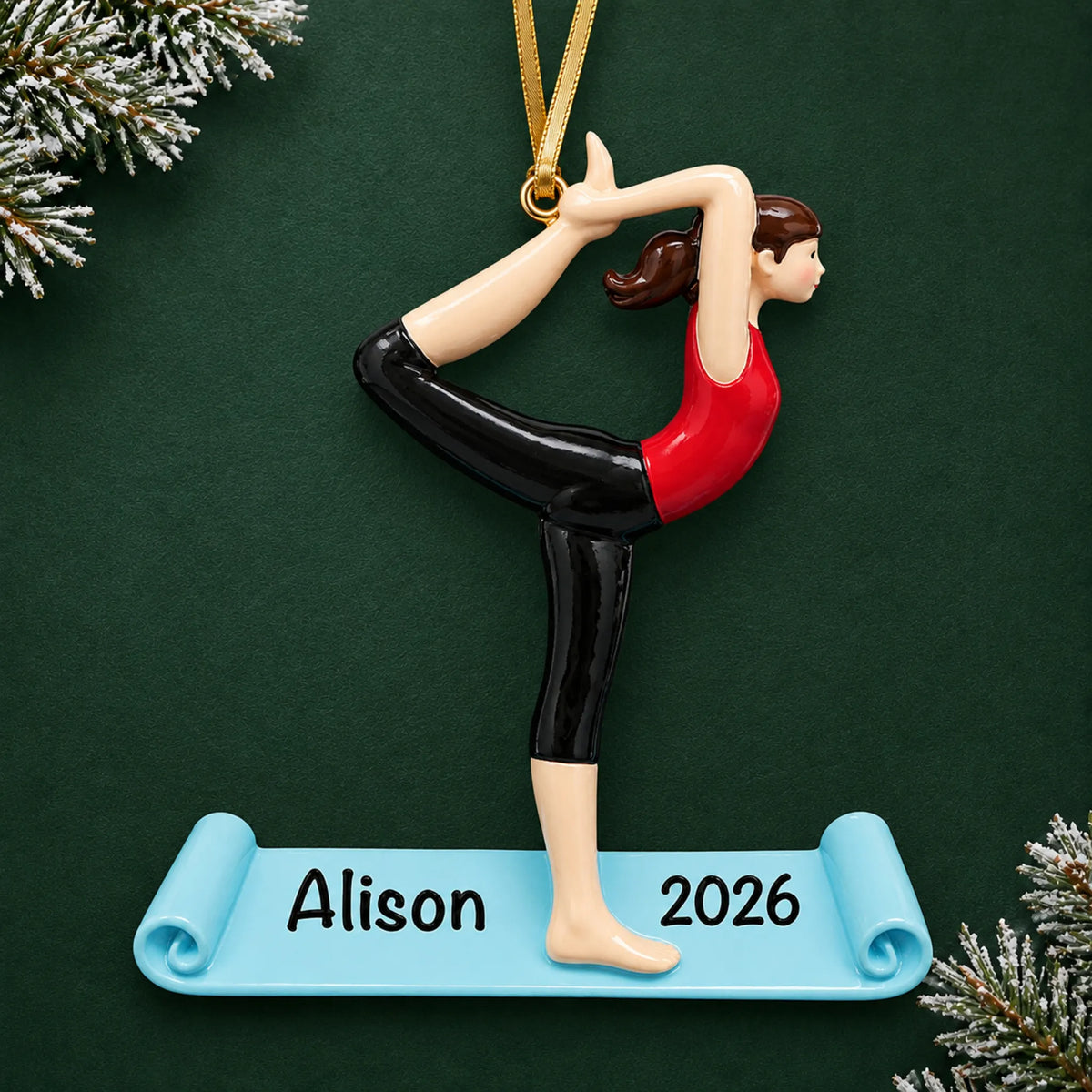 Personalized yoga christmas ornament on a dark green pine background