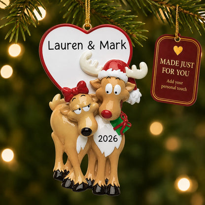 Reindeer couple christmas ornament hanging on a lit Christmas tree with a Made Just For You gift tag