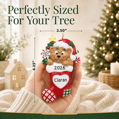 Size guide: the personalized Bear Stocking christmas ornament is 2.50 in wide by 4.25 in tall, shown in hand
