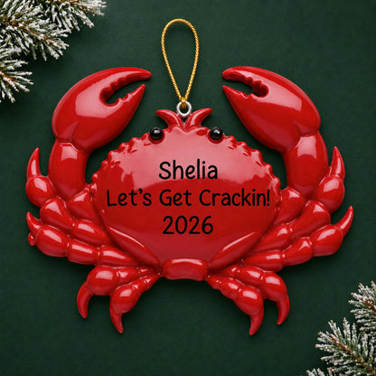 Personalized crab christmas ornament on a dark green pine background
