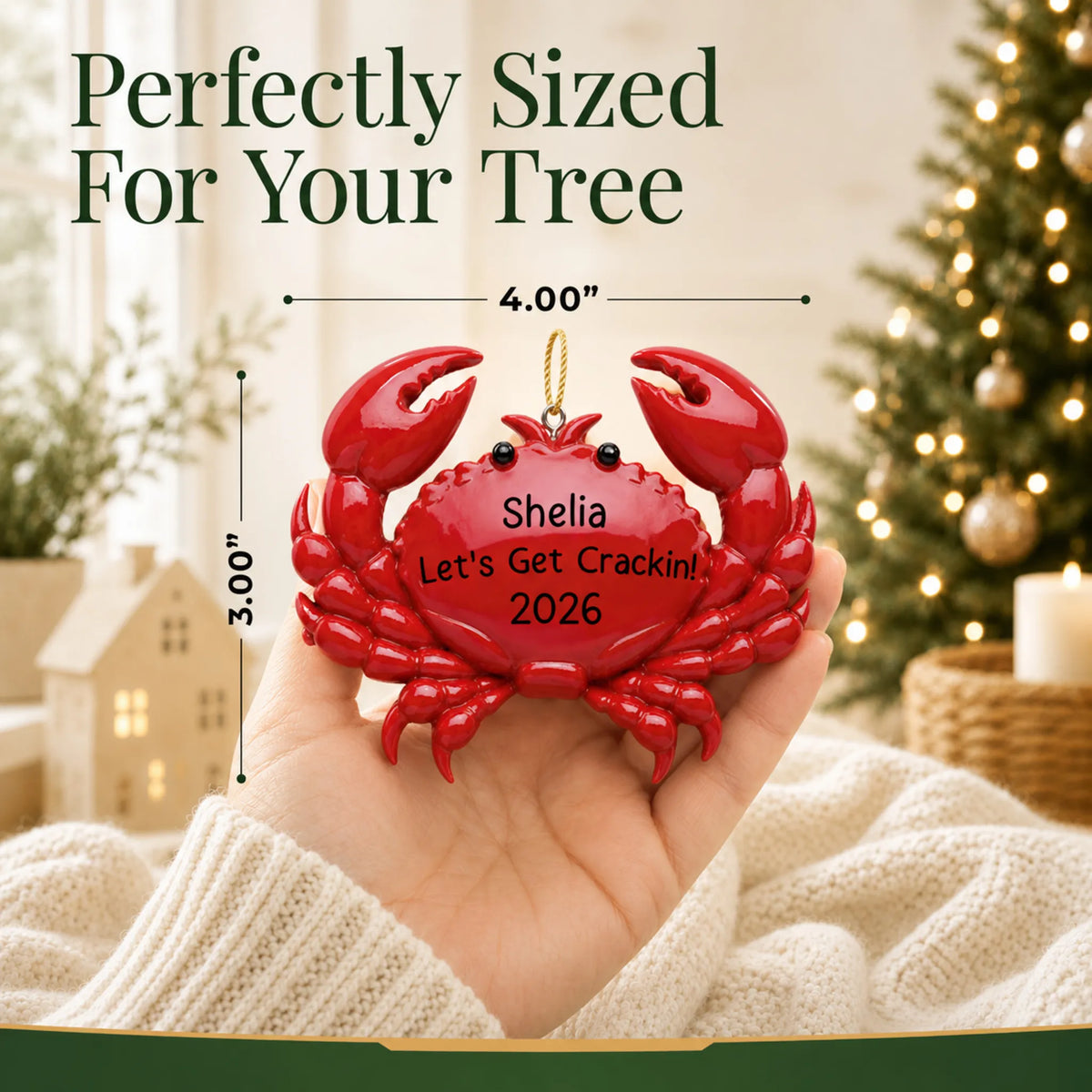 Size guide: the personalized crab christmas ornament is 4.00 in wide by 3.00 in tall, shown in hand
