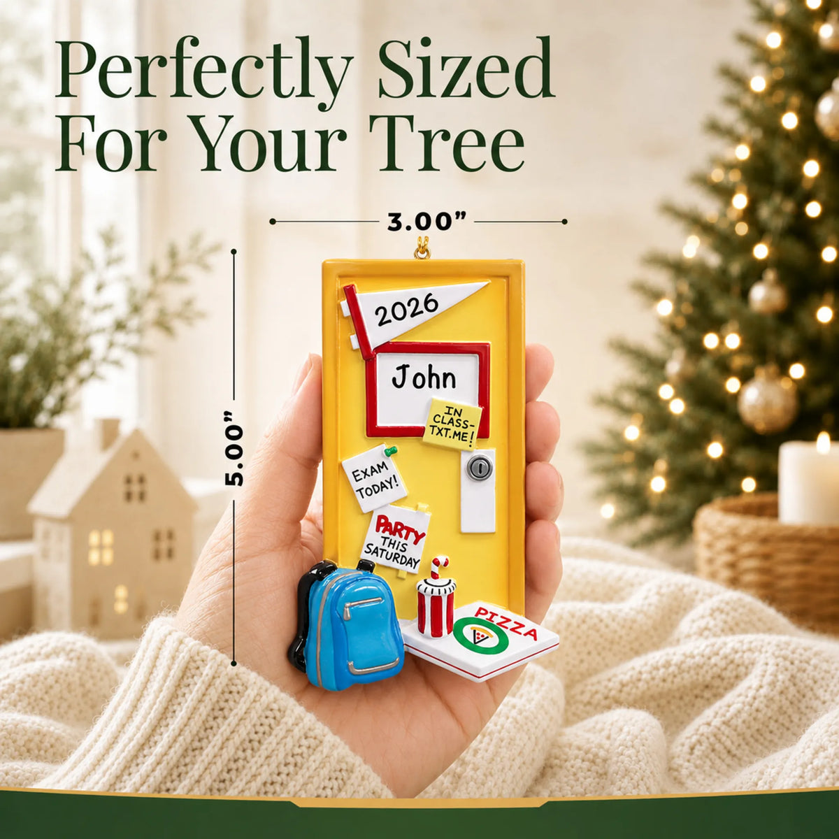 Size guide: the personalized college student dorm room christmas ornament shown in hand next to a Christmas tree