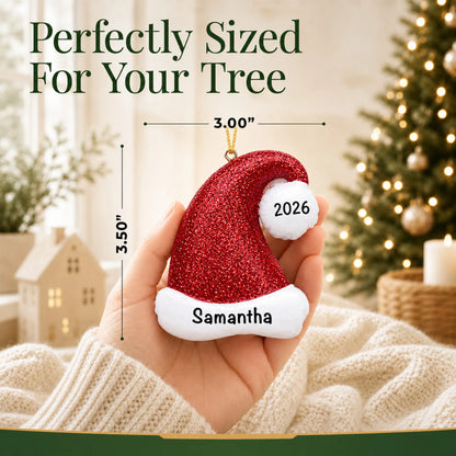 Size guide: the personalized Santa Glitter Hat christmas ornament is 3.00 in wide by 3.50 in tall, shown in hand