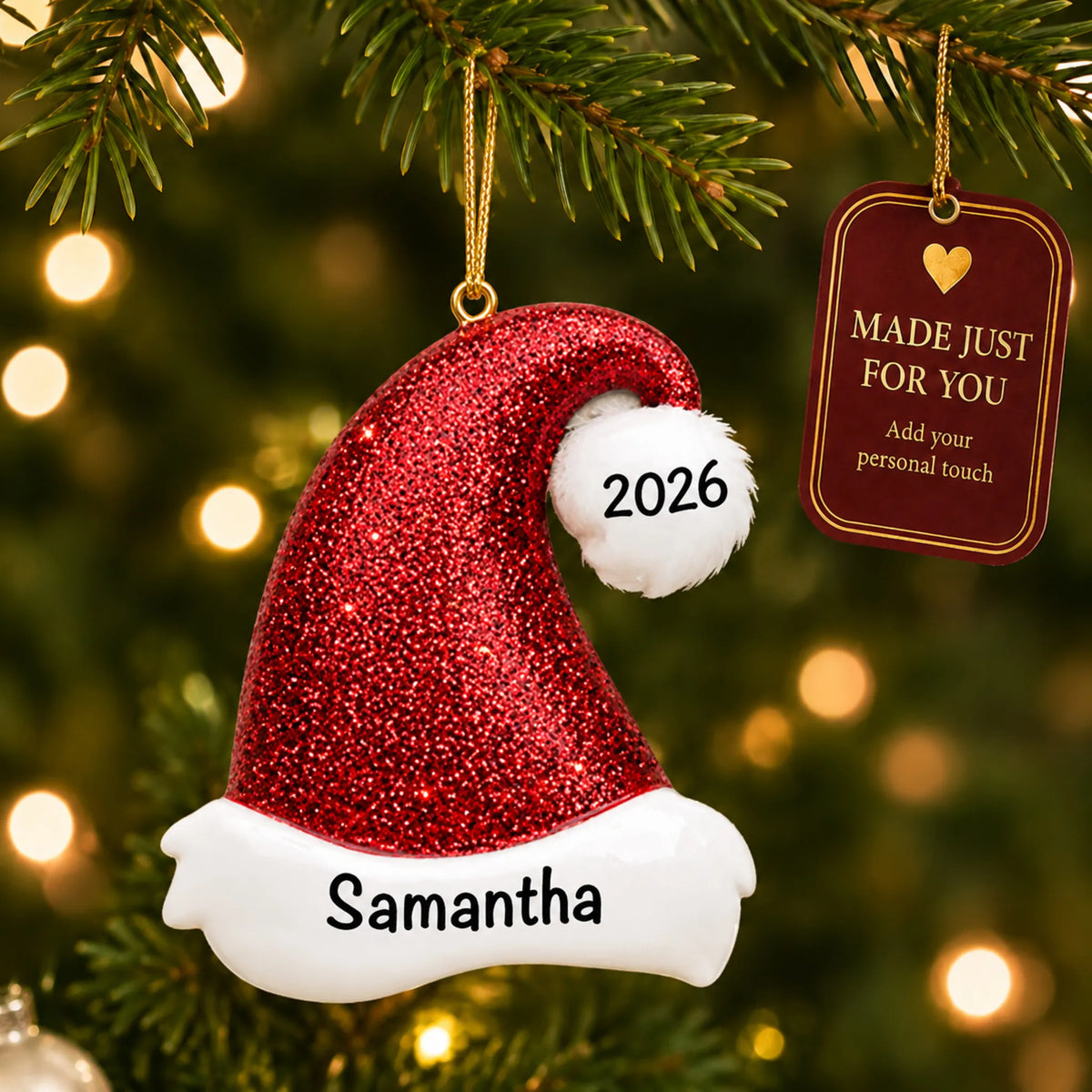 Santa Glitter Hat christmas ornament hanging on a lit Christmas tree with a Made Just For You gift tag