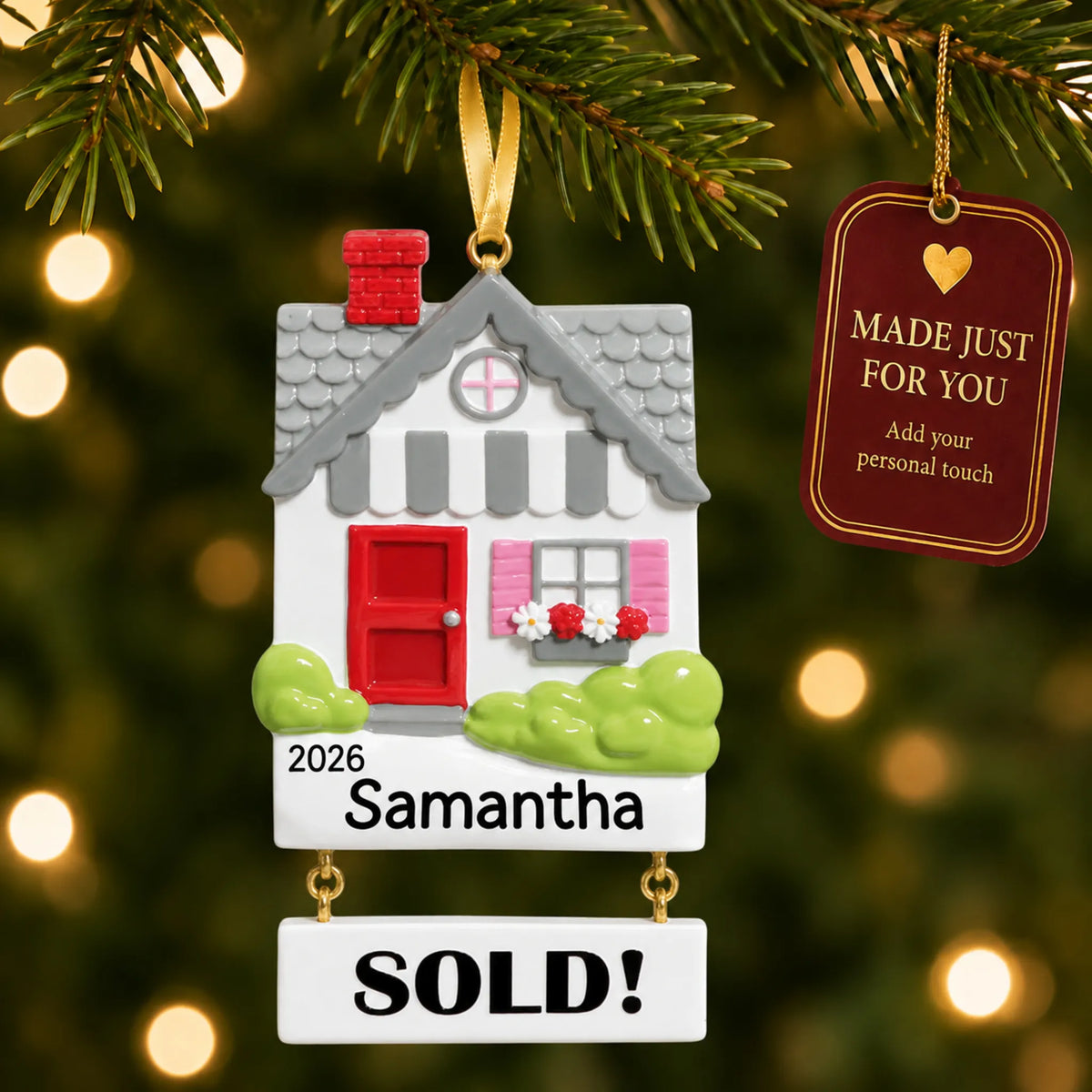 Real Estate Sold House christmas ornament hanging on a lit Christmas tree with a Made Just For You gift tag