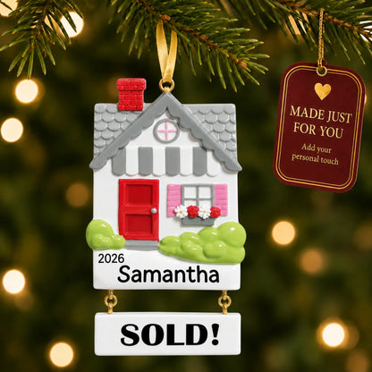 Real Estate Sold House christmas ornament hanging on a lit Christmas tree with a Made Just For You gift tag