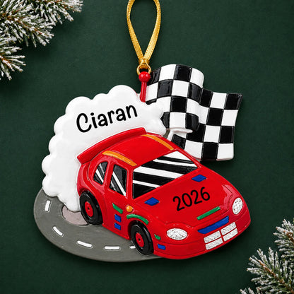 Personalized race car christmas ornament on a dark green pine background