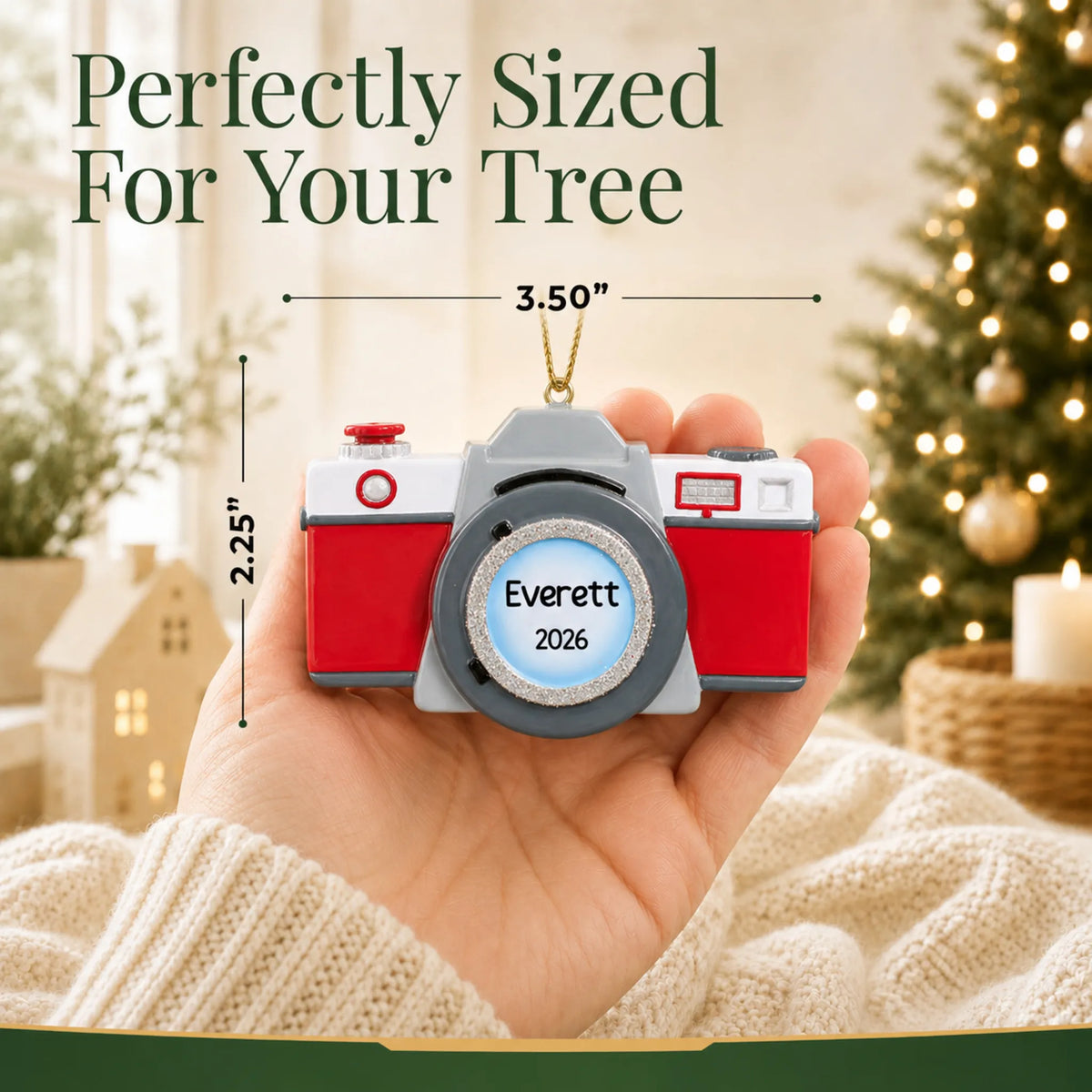 Size guide: the personalized camera christmas ornament is 3.50 in wide by 2.25 in tall, shown in hand