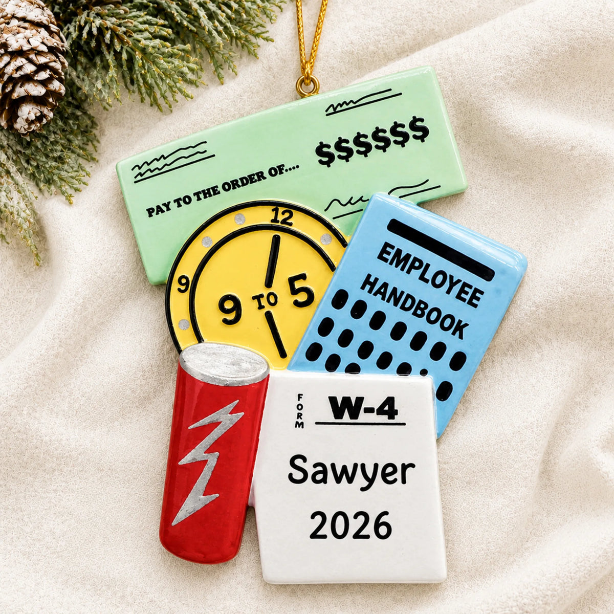 Personalized first job christmas ornament laid on a soft white knit blanket