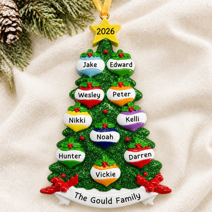 Personalized green glitter tree family of 10 christmas ornament laid on a soft white knit blanket