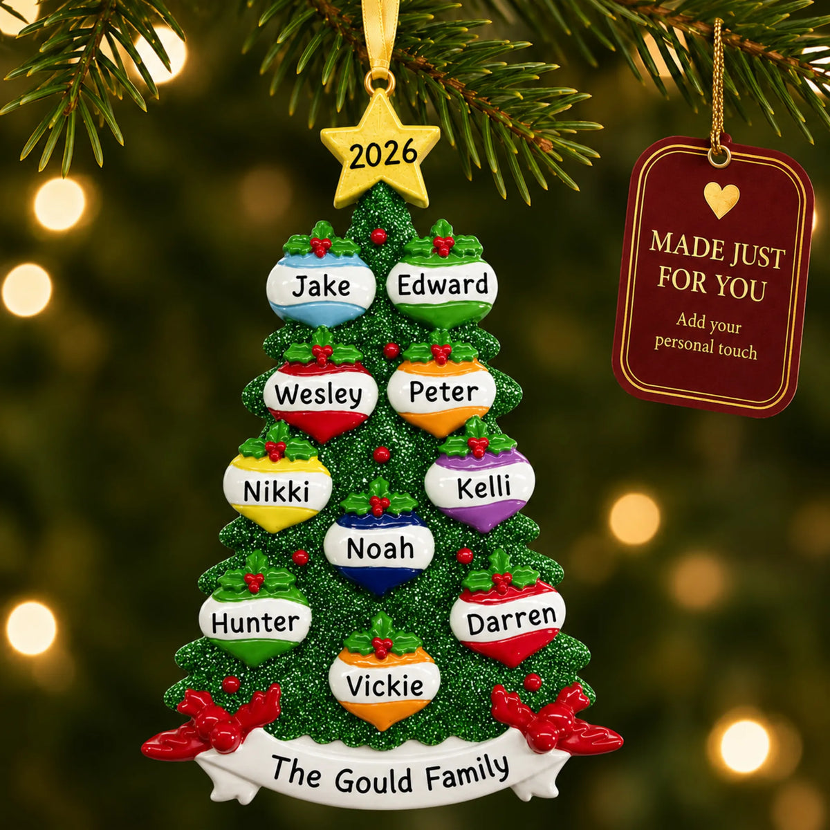 Green glitter tree family of 10 christmas ornament hanging on a lit Christmas tree with a Made Just For You gift tag