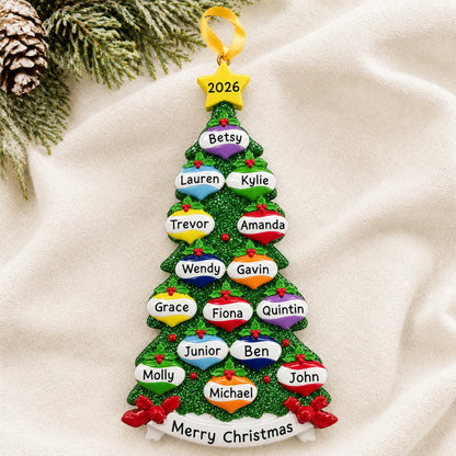 Personalized green glitter tree family of 15 christmas ornament laid on a soft white knit blanket