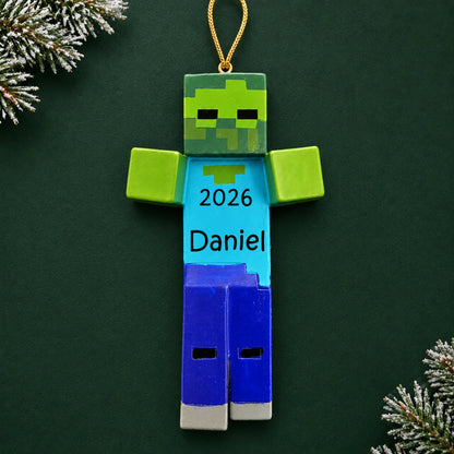 Personalized 3d blocky video game zombie christmas ornament on a dark green pine background