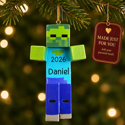 3d blocky video game zombie christmas ornament hanging on a lit Christmas tree with a Made Just For You gift tag