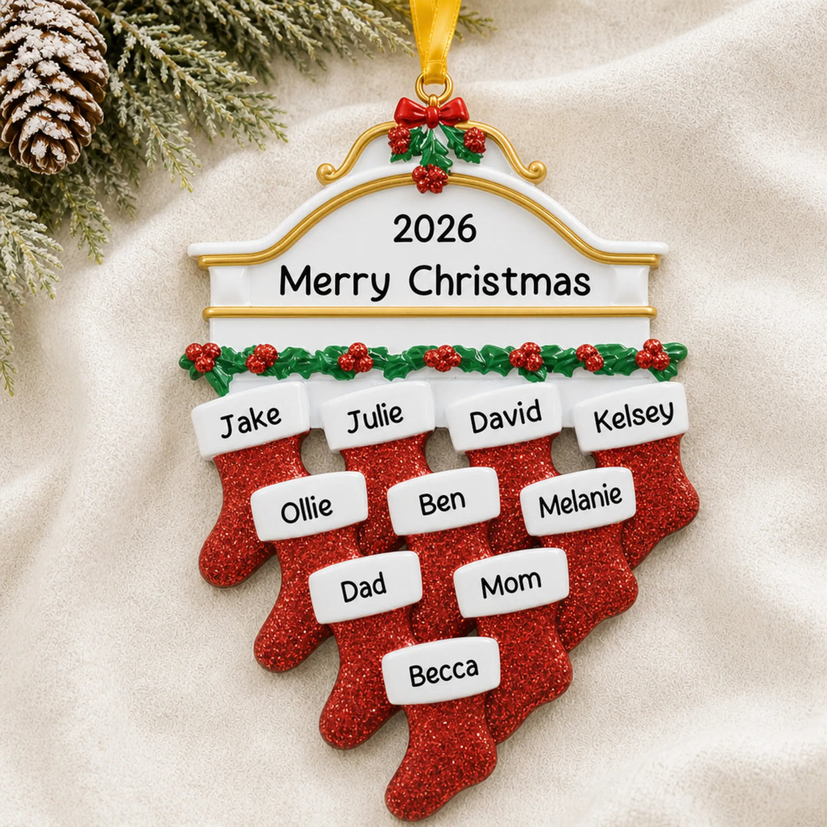 Personalized red stockings family of 10 christmas ornament laid on a soft white knit blanket