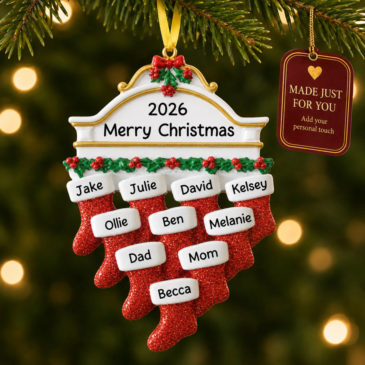 Red stockings family of 10 christmas ornament hanging on a lit Christmas tree with a Made Just For You gift tag