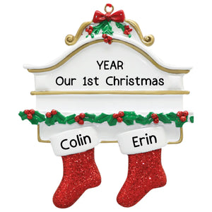 Personalized couple Christmas ornament with two red stockings on a mantle and custom names