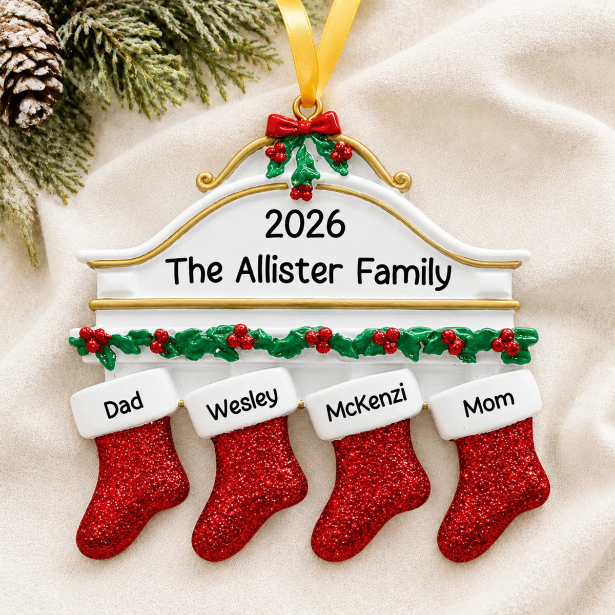 Personalized red stockings family of 4 christmas ornament laid on a soft white knit blanket