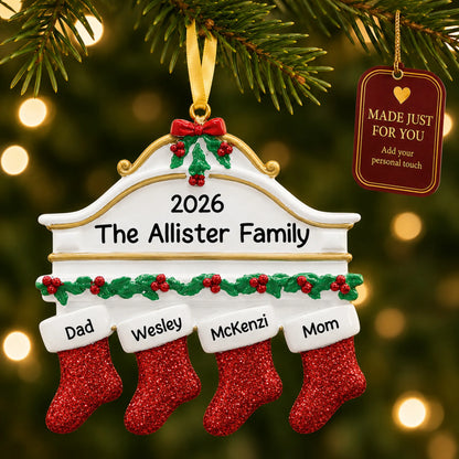 Red stockings family of 4 christmas ornament hanging on a lit Christmas tree with a Made Just For You gift tag