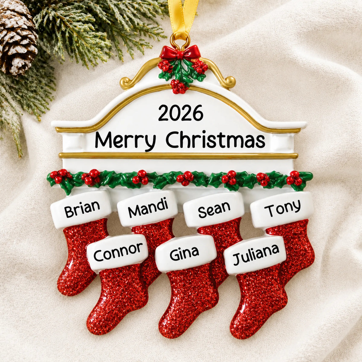 Personalized red stockings family of 7 christmas ornament laid on a soft white knit blanket