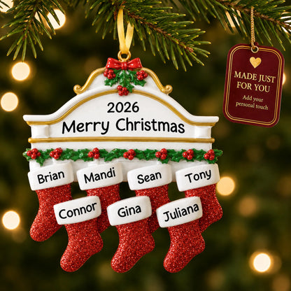 Red stockings family of 7 christmas ornament hanging on a lit Christmas tree with a Made Just For You gift tag