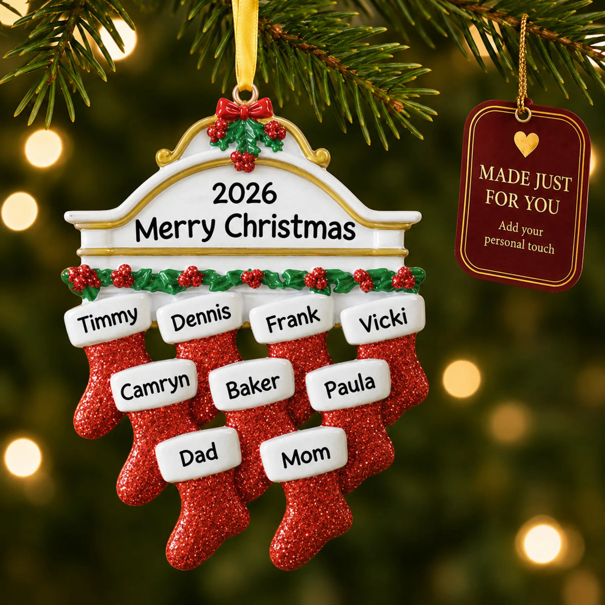 Red stockings family of 9 christmas ornament hanging on a lit Christmas tree with a Made Just For You gift tag
