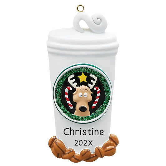 Personalized Christmas ornament shaped like a large white coffee cup with a lid, decorated with a festive reindeer logo and coffee beans, ready for custom name engraving.