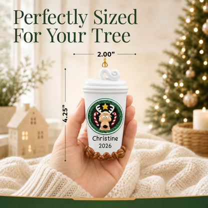 Size guide: the personalized Coffee Lover To-Go Cup christmas ornament is 2.00 in wide by 4.25 in tall, shown in hand