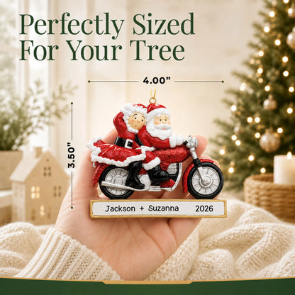 Size guide: the personalized santa couple motorcycle christmas ornament is 4.00 in wide by 3.50 in tall, shown in hand