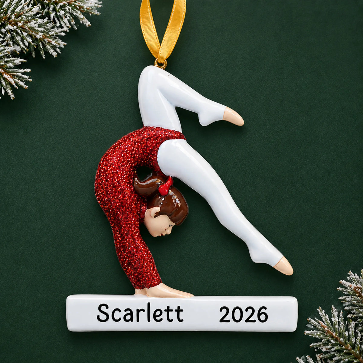 Personalized red glitter gymnastics girl christmas ornament on a dark green pine background
