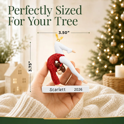 Size guide: the personalized red glitter gymnastics girl christmas ornament is 3.50 in wide by 3.75 in tall, shown in hand