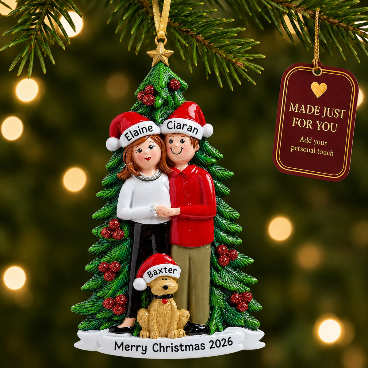 Couple with dog christmas ornament hanging on a lit Christmas tree with a Made Just For You gift tag