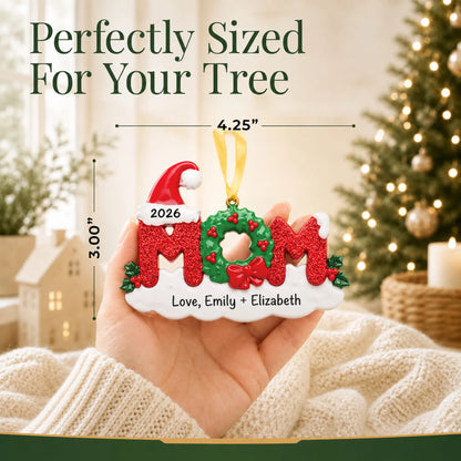 Size guide: the personalized mom christmas ornament is 4.25 in wide by 3.00 in tall, shown in hand