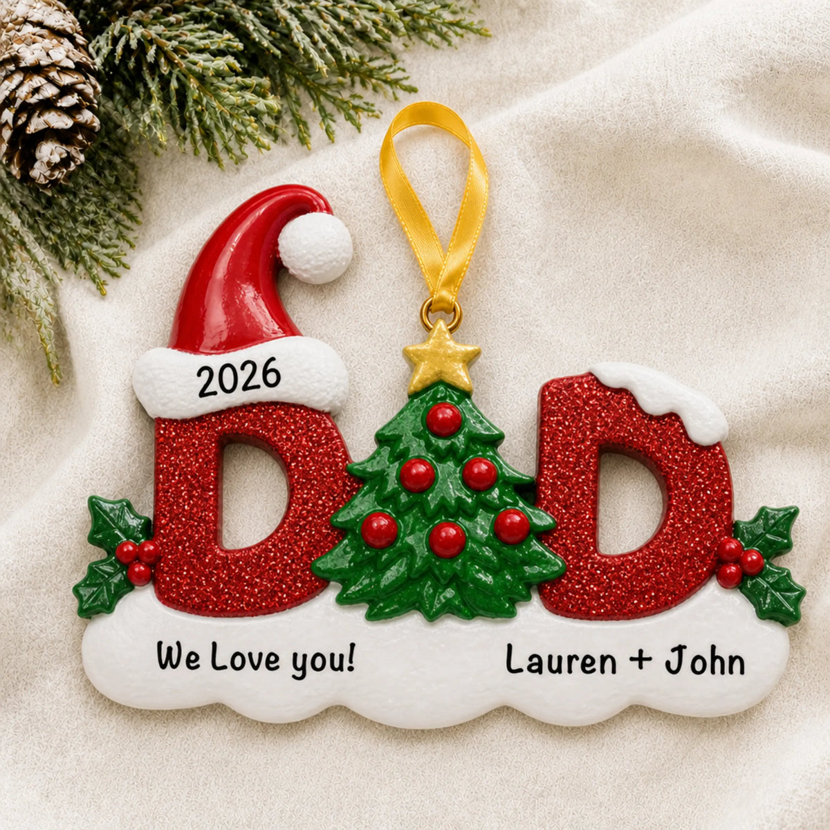 Personalized dad christmas ornament laid on a soft white knit blanket