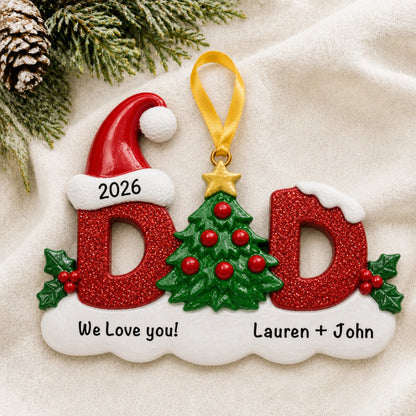 Personalized dad christmas ornament laid on a soft white knit blanket