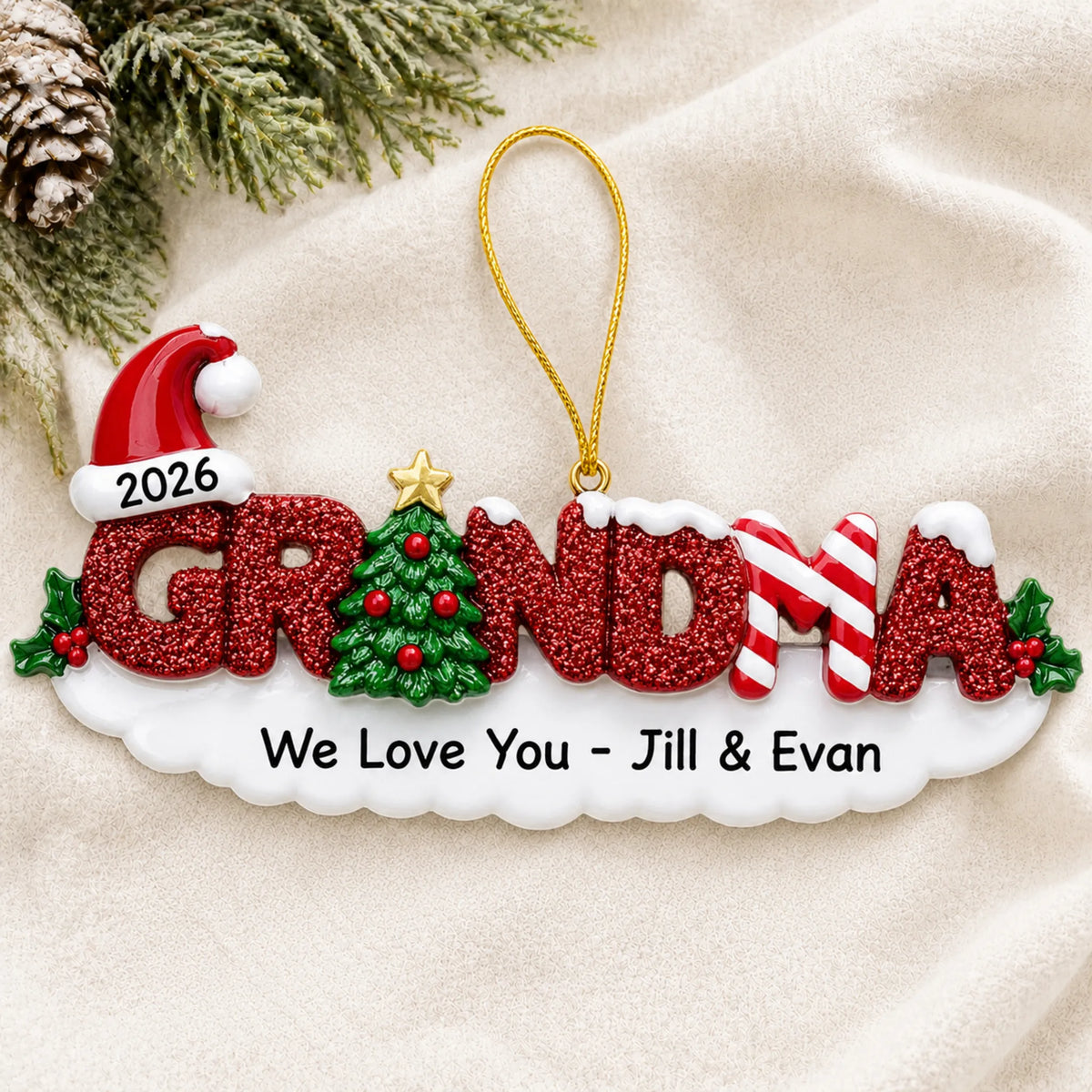 Personalized grandma christmas ornament laid on a soft white knit blanket